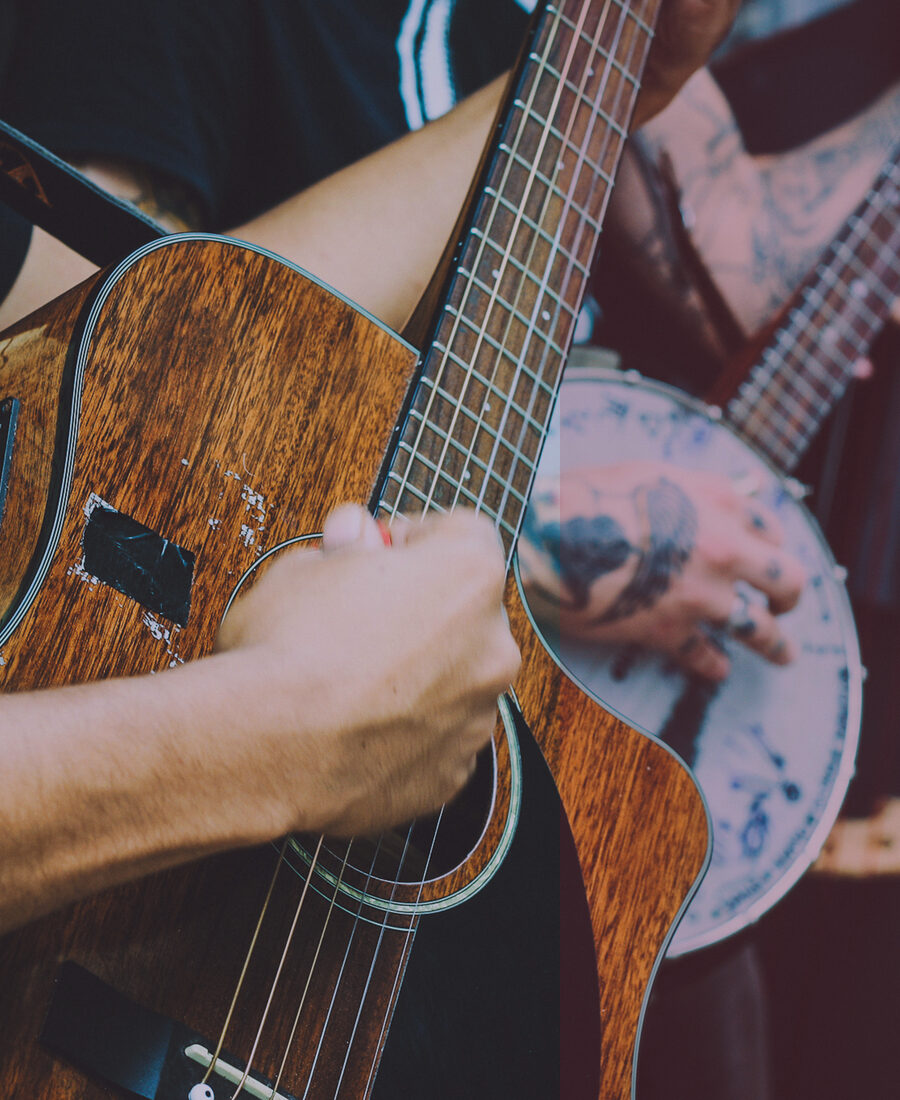 Hands playing guitar.